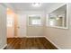 Dining area with vinyl flooring and view into kitchen and entryway at 2792 Plantation Dr, Atlanta, GA 30344