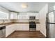 Updated kitchen with granite countertops and stainless steel appliances at 2792 Plantation Dr, Atlanta, GA 30344