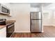 Stainless steel appliances and granite countertops highlight this kitchen at 2792 Plantation Dr, Atlanta, GA 30344