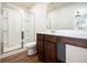Bathroom features a glass shower, a wooden vanity and laminate flooring at 915 Highwood Ln, Atlanta, GA 30344