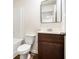 Bathroom with a dark wood vanity, modern mirror, and toilet at 915 Highwood Ln, Atlanta, GA 30344
