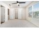Bright bedroom has a ceiling fan, and a walk-in closet and multiple entry doors at 915 Highwood Ln, Atlanta, GA 30344
