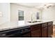 Kitchen with dark wooden cabinets and modern appliances at 915 Highwood Ln, Atlanta, GA 30344