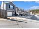 Street view of townhomes featuring garage parking and landscaped yards at 915 Highwood Ln, Atlanta, GA 30344