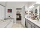 Main bathroom with double vanity and access to bedroom at 920 Bridge Mill Ave, Canton, GA 30114