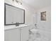 Clean bathroom with white vanity, tub, and updated fixtures at 1008 King Rd, Riverdale, GA 30296