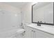 Clean bathroom with white vanity, tub, and updated fixtures at 1008 King Rd, Riverdale, GA 30296