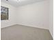 Charming bedroom with neutral carpeting and ample natural light at 1008 King Rd, Riverdale, GA 30296