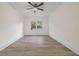 Spacious bedroom with wood-look floors and a large window at 1008 King Rd, Riverdale, GA 30296