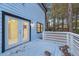 Back deck with access from interior, modern white railing, and blue paint at 1008 King Rd, Riverdale, GA 30296