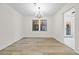 Bright dining room with hardwood floors and chandelier at 1008 King Rd, Riverdale, GA 30296