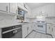 Updated kitchen features white cabinets, marble backsplash, and stainless steel appliances at 1008 King Rd, Riverdale, GA 30296
