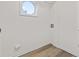Laundry area with vinyl flooring and a round window at 1008 King Rd, Riverdale, GA 30296