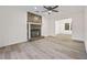 Living room with stone fireplace and hardwood floors at 1008 King Rd, Riverdale, GA 30296