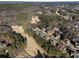 Aerial view of a luxury community featuring mature trees, sprawling lawns, and golf course views at 183 Applewood Ln, Acworth, GA 30101