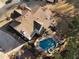 Stunning aerial view of a home featuring a backyard pool, spa, patio, and meticulously landscaped grounds at 183 Applewood Ln, Acworth, GA 30101