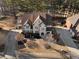 Aerial view of a well-manicured front yard and landscaping, long driveway and large home at 183 Applewood Ln, Acworth, GA 30101