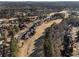 Scenic aerial view of a lovely neighborhood with a golf course and beautiful, mature trees at 183 Applewood Ln, Acworth, GA 30101