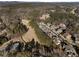 An aerial view of the community featuring wooded surroundings and a golf course at 183 Applewood Ln, Acworth, GA 30101