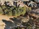 A high-angle view of a tree-lined neighborhood, casting shadows on a lush fairway, and the rooftops of multiple homes at 183 Applewood Ln, Acworth, GA 30101