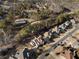 Aerial view of a luxury home in a lush community with mature trees, sidewalks, and an in-ground pool at 183 Applewood Ln, Acworth, GA 30101