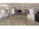 Basement bar area featuring granite counters, stone accents, and extensive shelving at 183 Applewood Ln, Acworth, GA 30101