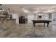 Spacious basement with stone bar, shelving, pool table, neutral walls, and tile floors at 183 Applewood Ln, Acworth, GA 30101