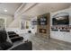 Basement theater area with stone fireplace, built-in shelving and entertainment center at 183 Applewood Ln, Acworth, GA 30101