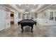 Finished basement with a billiard table and access to a bar area with backyard views at 183 Applewood Ln, Acworth, GA 30101