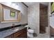 Beautiful bathroom featuring a granite countertop, copper sink, and a tiled walk-in shower at 183 Applewood Ln, Acworth, GA 30101