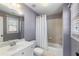 Bathroom featuring a shower, vanity, toilet, and window; ready for customization at 183 Applewood Ln, Acworth, GA 30101