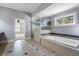 A luxurious bathroom with a tub, a walk-in shower, and bright natural lighting at 183 Applewood Ln, Acworth, GA 30101
