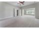 A large bedroom with a ceiling fan and natural light from the windows at 183 Applewood Ln, Acworth, GA 30101