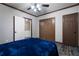 Bedroom featuring wood-look flooring, closet and ceiling fan with light fixture at 183 Applewood Ln, Acworth, GA 30101
