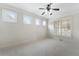 Bright bedroom with neutral walls, carpet, ceiling fan, windows and plantation shutters at 183 Applewood Ln, Acworth, GA 30101