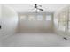 Bright bedroom with neutral walls, carpet, ceiling fan, windows and plantation shutters at 183 Applewood Ln, Acworth, GA 30101
