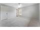 Serene bedroom with neutral walls, plush carpeting, and a window offering backyard views at 183 Applewood Ln, Acworth, GA 30101