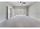 Large bedroom with light colored carpet and ceiling fan at 183 Applewood Ln, Acworth, GA 30101