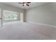 Spacious carpeted bedroom with ceiling fan and abundant light at 183 Applewood Ln, Acworth, GA 30101