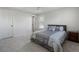 Inviting bedroom with soft carpet, ceiling fan, and a comfortable bed with stylish linens at 183 Applewood Ln, Acworth, GA 30101
