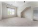 A spacious bedroom with soft carpeting and a window providing natural light at 183 Applewood Ln, Acworth, GA 30101