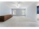 Spacious bedroom featuring a ceiling fan, neutral paint, and two large windows for natural light at 183 Applewood Ln, Acworth, GA 30101