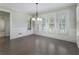 Sun-filled dining room featuring large windows with shutters and hardwood floors at 183 Applewood Ln, Acworth, GA 30101