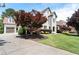 Charming white brick home featuring manicured landscaping, driveway, and an attached two car garage at 183 Applewood Ln, Acworth, GA 30101