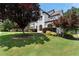 Landscaped home with manicured lawn, shrubbery, and brick and painted facade at 183 Applewood Ln, Acworth, GA 30101