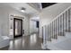 Spacious foyer with hardwood floors, stairway and a decorative glass front door at 183 Applewood Ln, Acworth, GA 30101