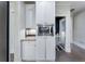 Bright kitchen area boasting white cabinetry, granite countertop, and stainless-steel microwave at 183 Applewood Ln, Acworth, GA 30101