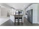 Gourmet kitchen with granite counters, stainless appliances, and breakfast bar seating at 183 Applewood Ln, Acworth, GA 30101