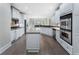Bright kitchen featuring granite counters, island, and stainless steel appliances at 183 Applewood Ln, Acworth, GA 30101