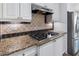 Updated kitchen featuring granite countertops, tile backsplash, stainless steel appliances and modern fixtures at 183 Applewood Ln, Acworth, GA 30101